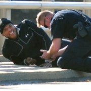 injured man getting help from officer