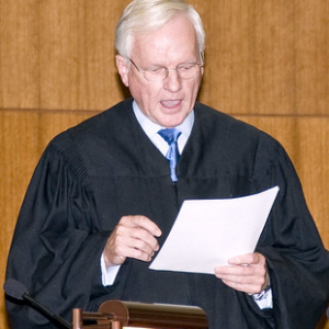 judge reading orders from document