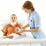 nurse tending to woman in neck brace and arm cast